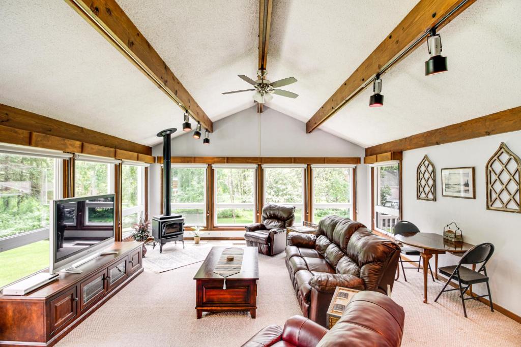 a living room with couches and a tv at Duluth Lake House - Walk to Beach and Boat Ramp! in Hermantown