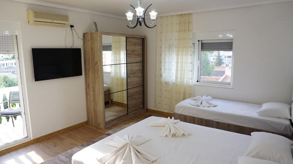 Postel nebo postele na pokoji v ubytování Guesthouse Sinani