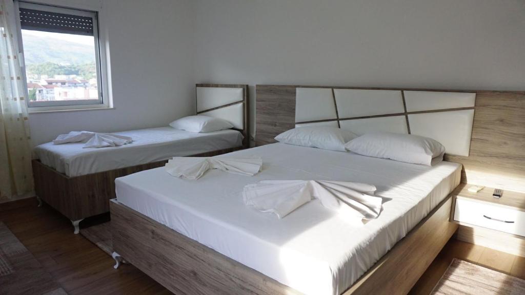 Postel nebo postele na pokoji v ubytování Guesthouse Sinani