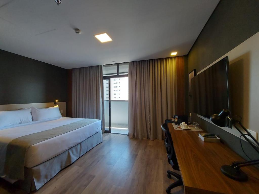 Postel nebo postele na pokoji v ubytování URBAN by UNU Osasco Hotel