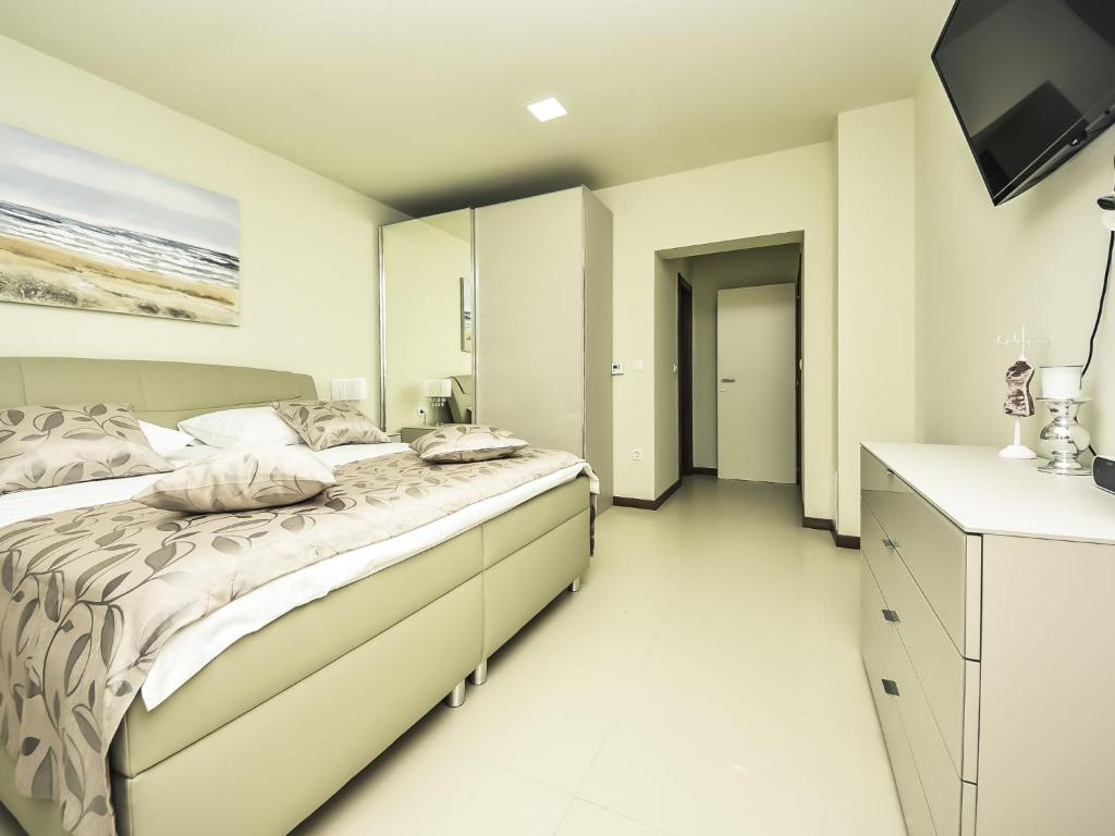 Posteľ alebo postele v izbe v ubytovaní Holiday Home Korina by Interhome