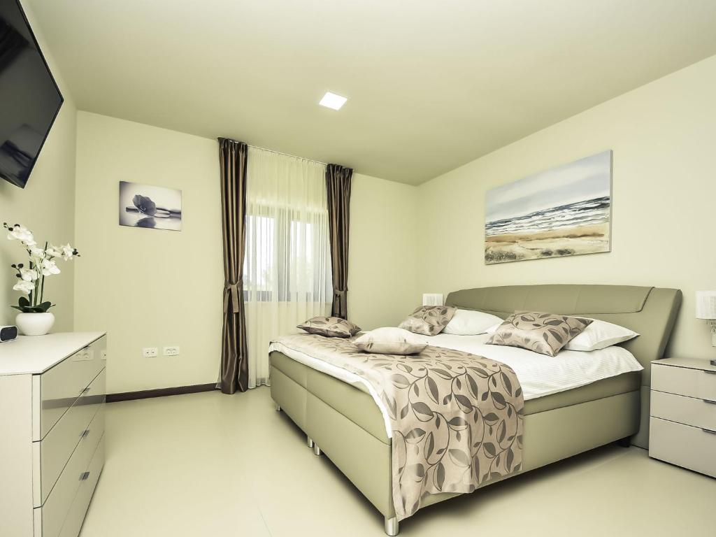 Posteľ alebo postele v izbe v ubytovaní Holiday Home Korina by Interhome