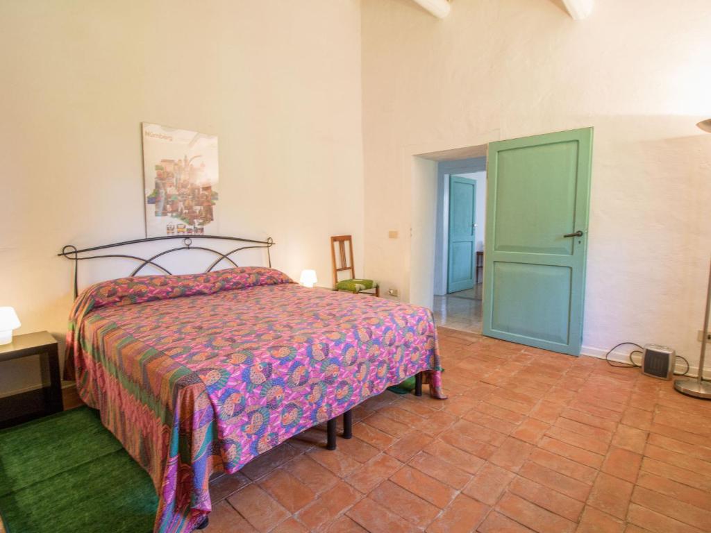 A bed or beds in a room at Holiday Home Casale Del Re by Interhome