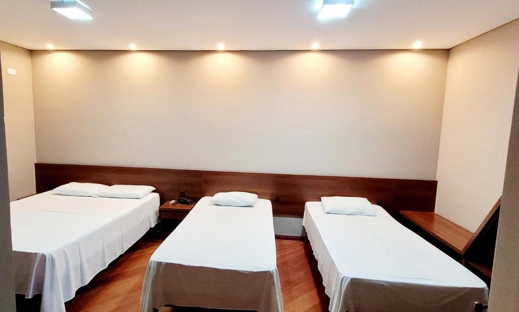 Postel nebo postele na pokoji v ubytování Hotel Bella Vista