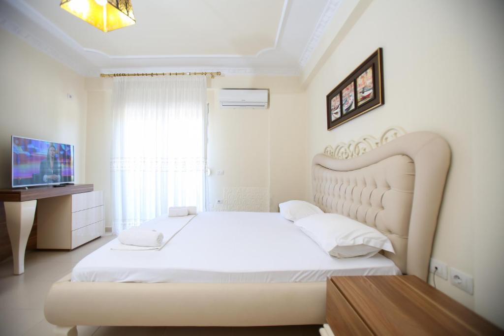 Postel nebo postele na pokoji v ubytování Oasis Residence