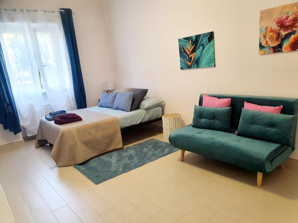 a living room with a couch and a table at Alloggio Vimercati 45 in Rome