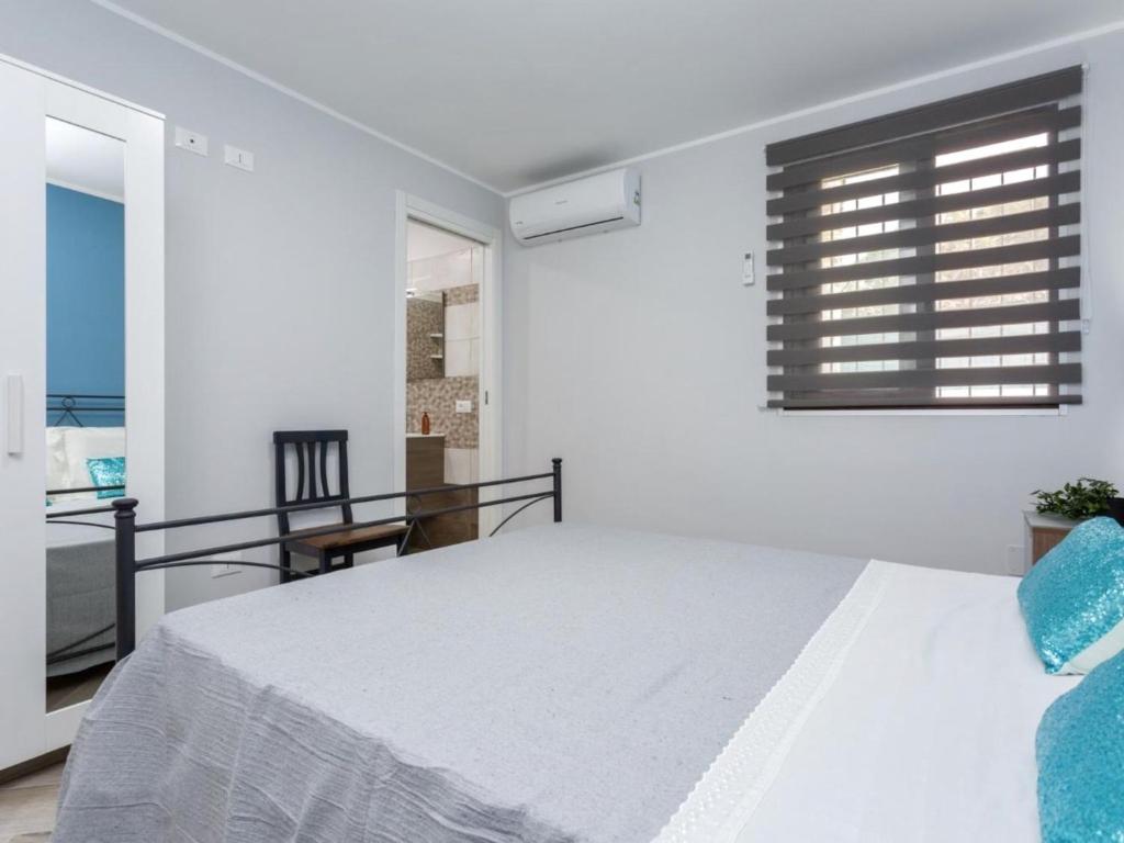 Łóżko lub łóżka w pokoju w obiekcie Villa Elena by Interhome