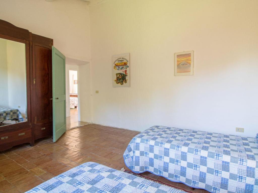 A bed or beds in a room at Holiday Home Casale Del Re by Interhome