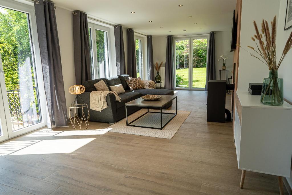 a living room with a couch and a table at Chez Jojo - Gîte rural in Spa