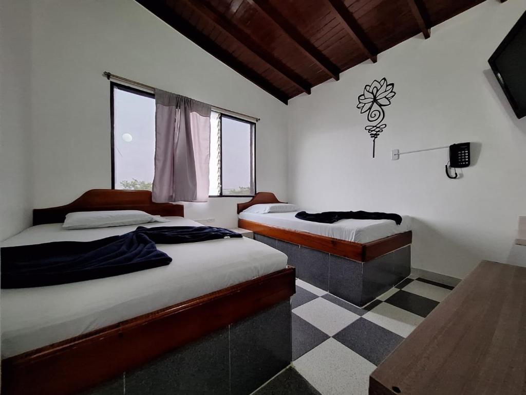 Postel nebo postele na pokoji v ubytování Hotel Playa Sur