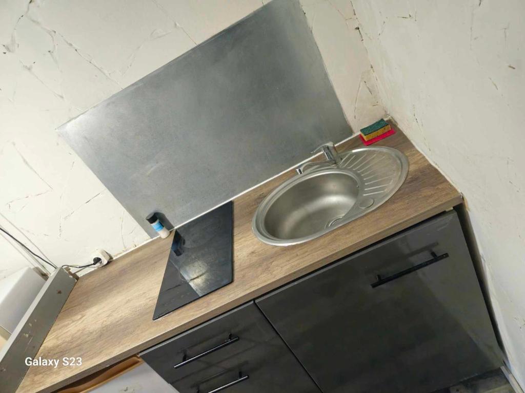 Kuchyň nebo kuchyňský kout v ubytování studio cœur de ville