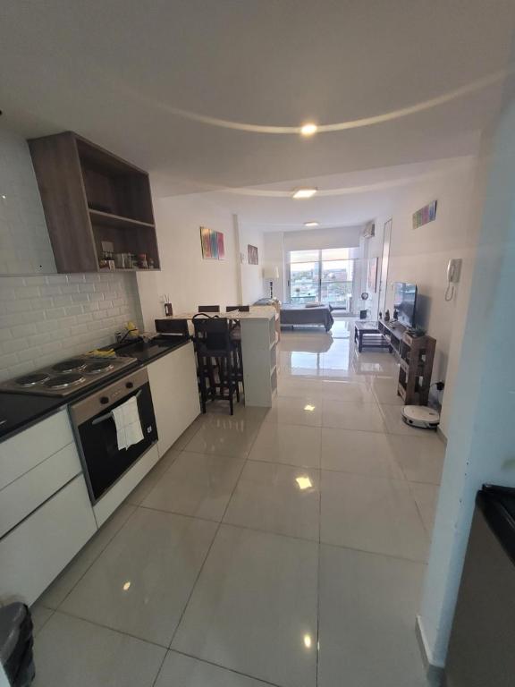 a large white kitchen with a stove top oven at Hermoso 1amb Lindo SuperCompleto in Buenos Aires