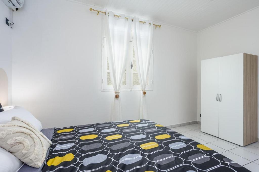 Postel nebo postele na pokoji v ubytování Foyal Toloman - Emeraude Lodge
