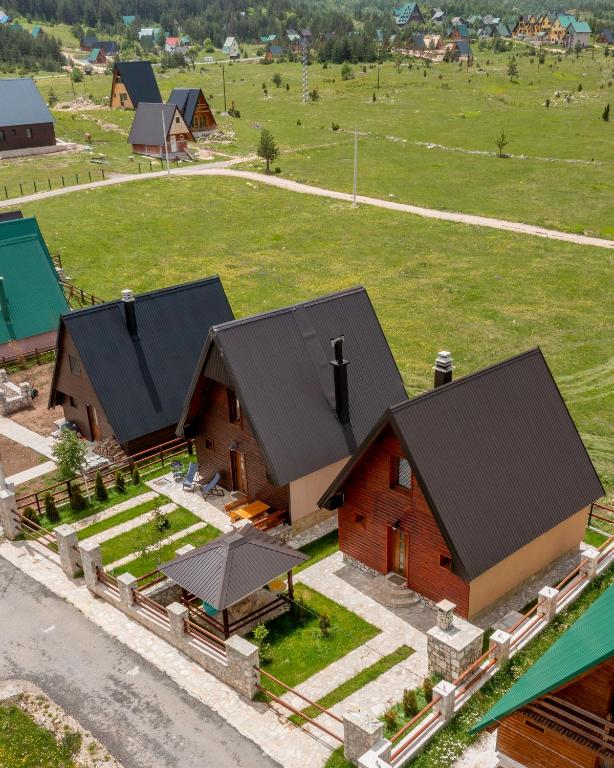 an aerial view of a farm with a house at Sweet Home Zabljak in Žabljak