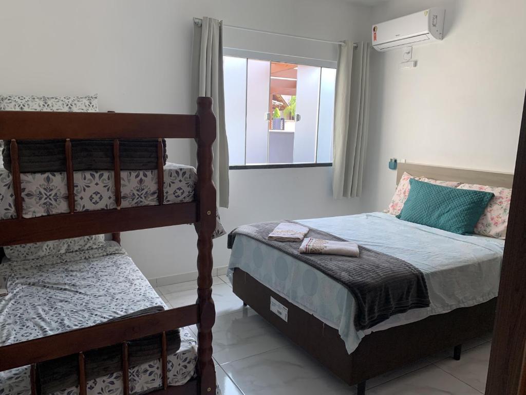 Ένα ή περισσότερα κρεβάτια σε δωμάτιο στο Condomínio Casa do Lago - Casas Completas