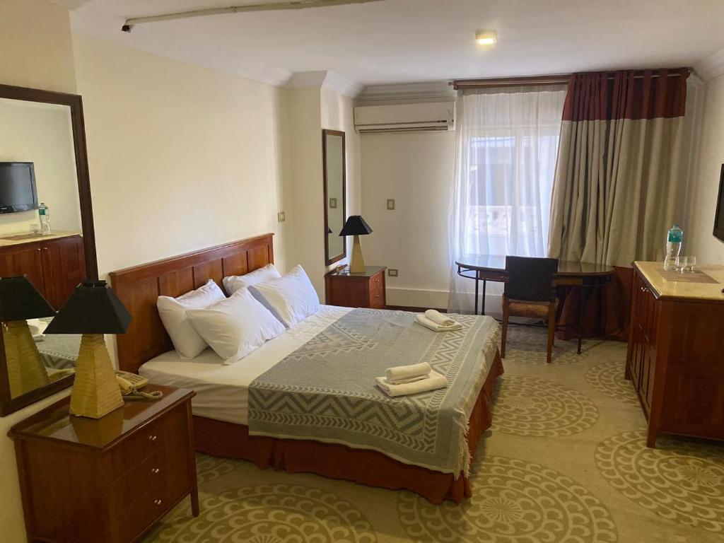 Postel nebo postele na pokoji v ubytování Bianchi Hotel