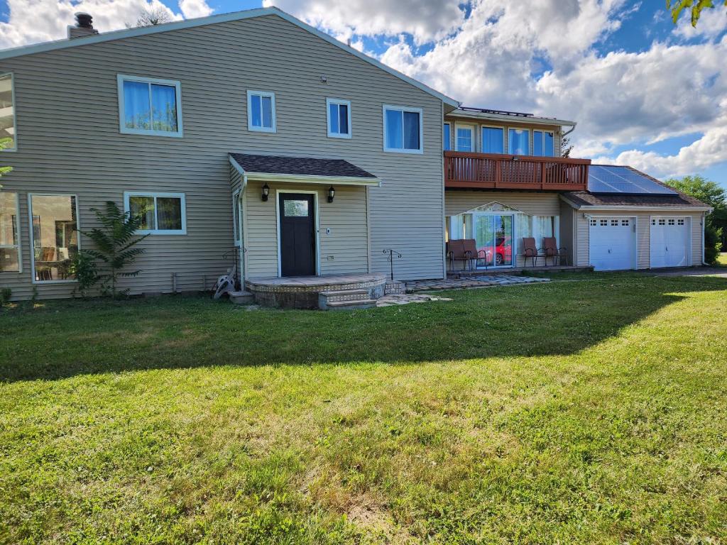 a house with a large yard in front of it at Beautiful home with mountain top views with an EV and NEMA connection!! in Poughkeepsie