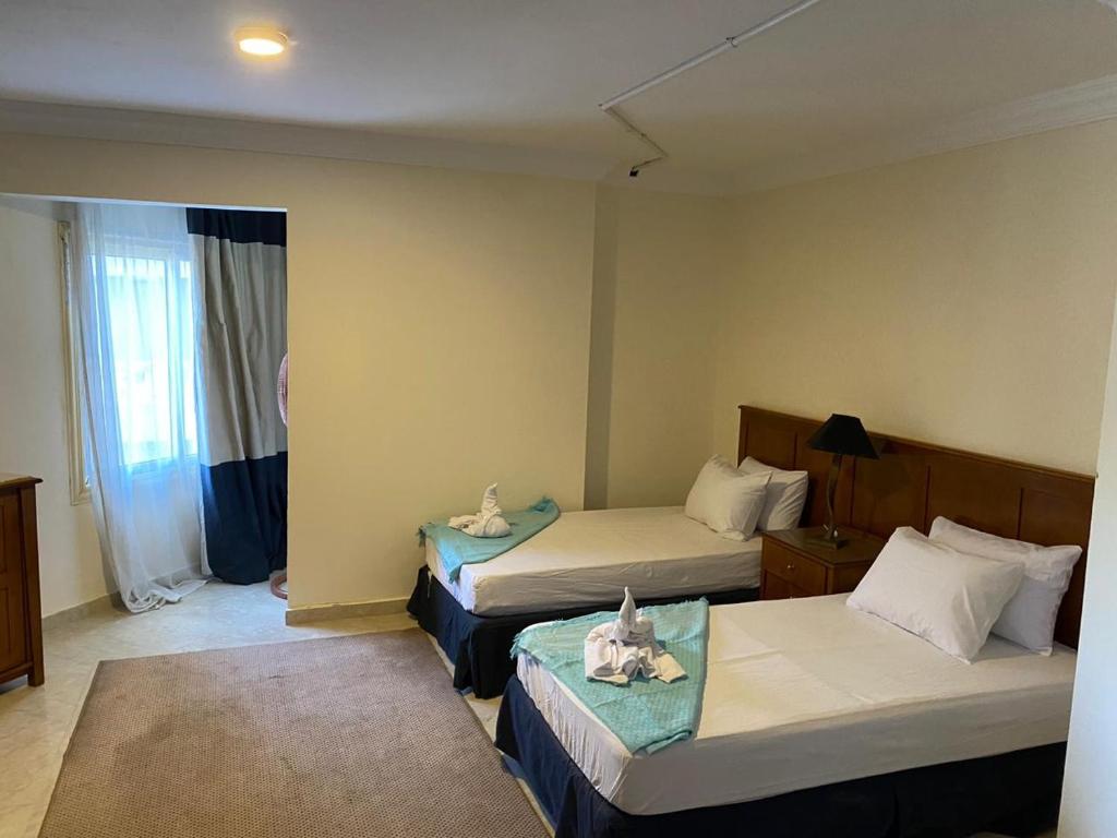 Postel nebo postele na pokoji v ubytování Bianchi Hotel
