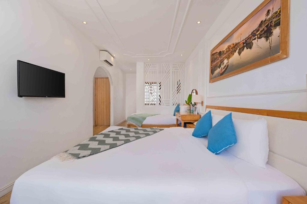 Postel nebo postele na pokoji v ubytování Lime Villa Hoi An