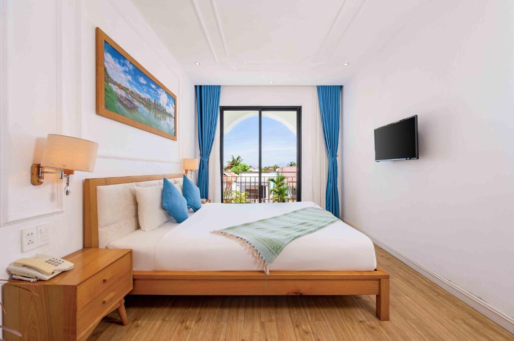 Postel nebo postele na pokoji v ubytování Lime Villa Hoi An