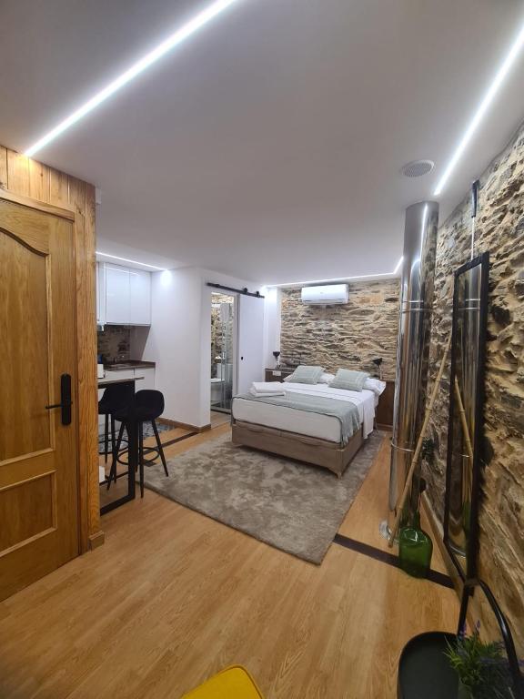 Ένα ή περισσότερα κρεβάτια σε δωμάτιο στο Apartamento - estudio OCARALLO29