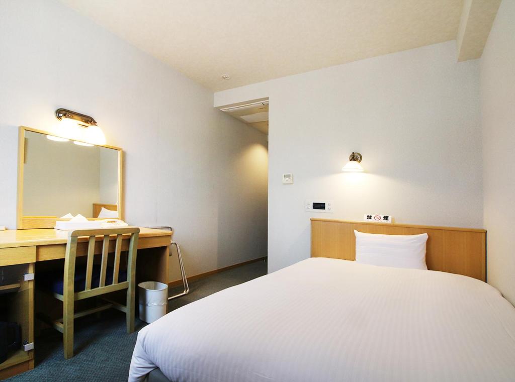 Postel nebo postele na pokoji v ubytování Island Hotel