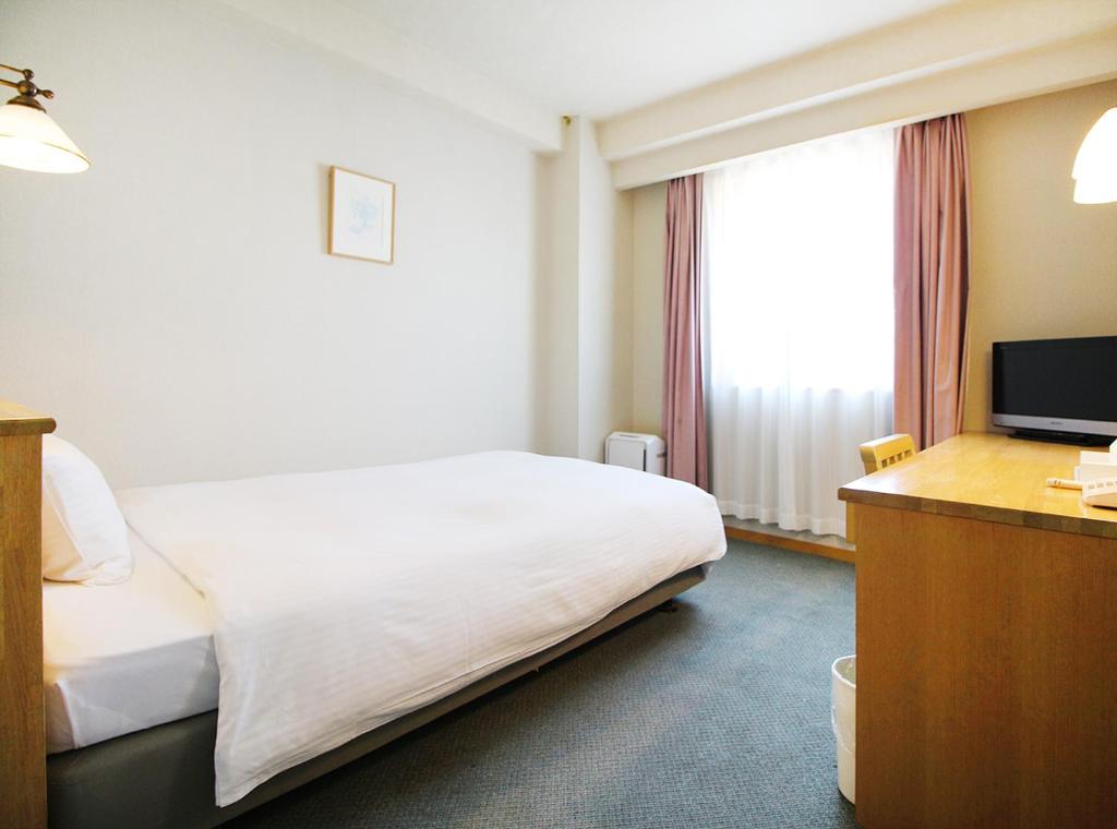 TV a/nebo společenská místnost v ubytování Island Hotel