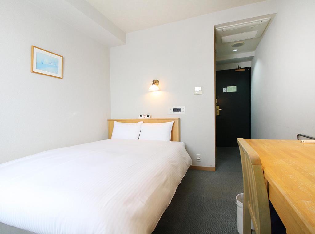 Postel nebo postele na pokoji v ubytování Island Hotel