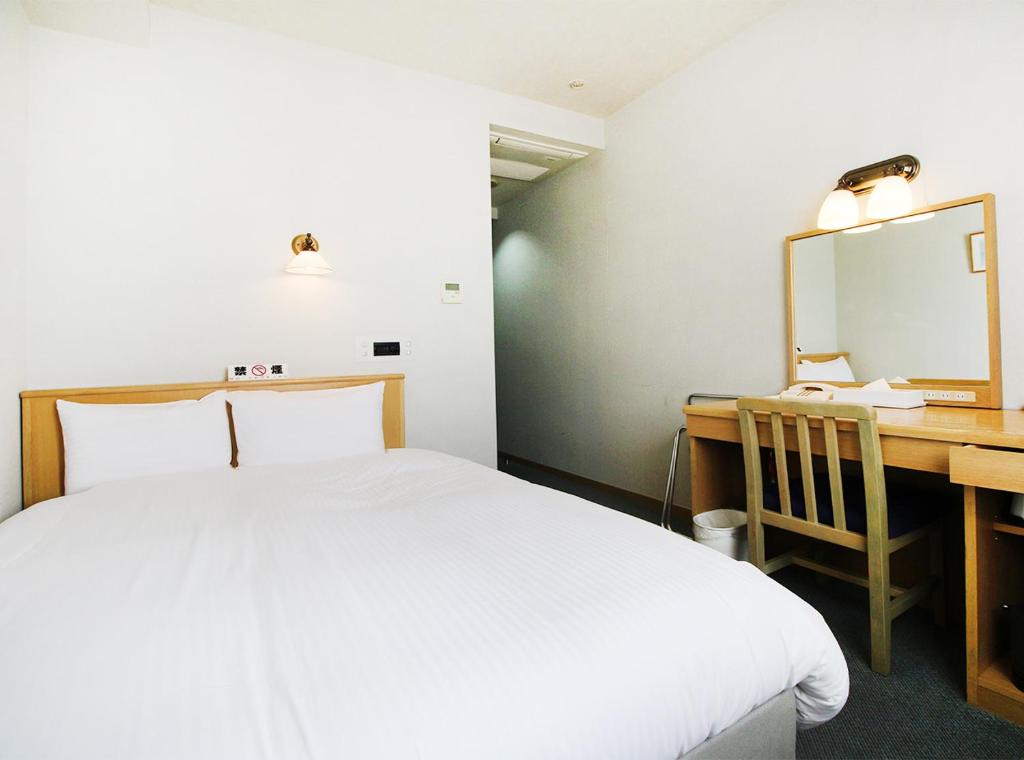 Postel nebo postele na pokoji v ubytování Island Hotel