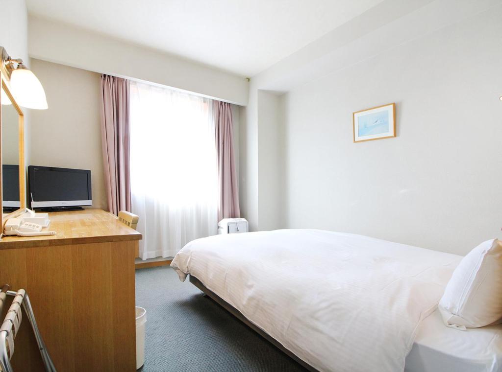 Postel nebo postele na pokoji v ubytování Island Hotel