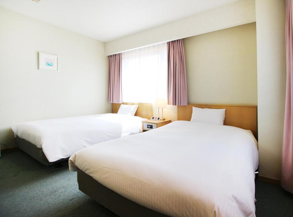Postel nebo postele na pokoji v ubytování Island Hotel
