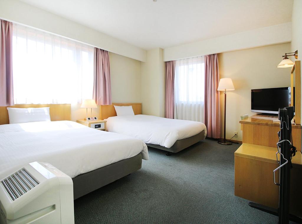 Postel nebo postele na pokoji v ubytování Island Hotel