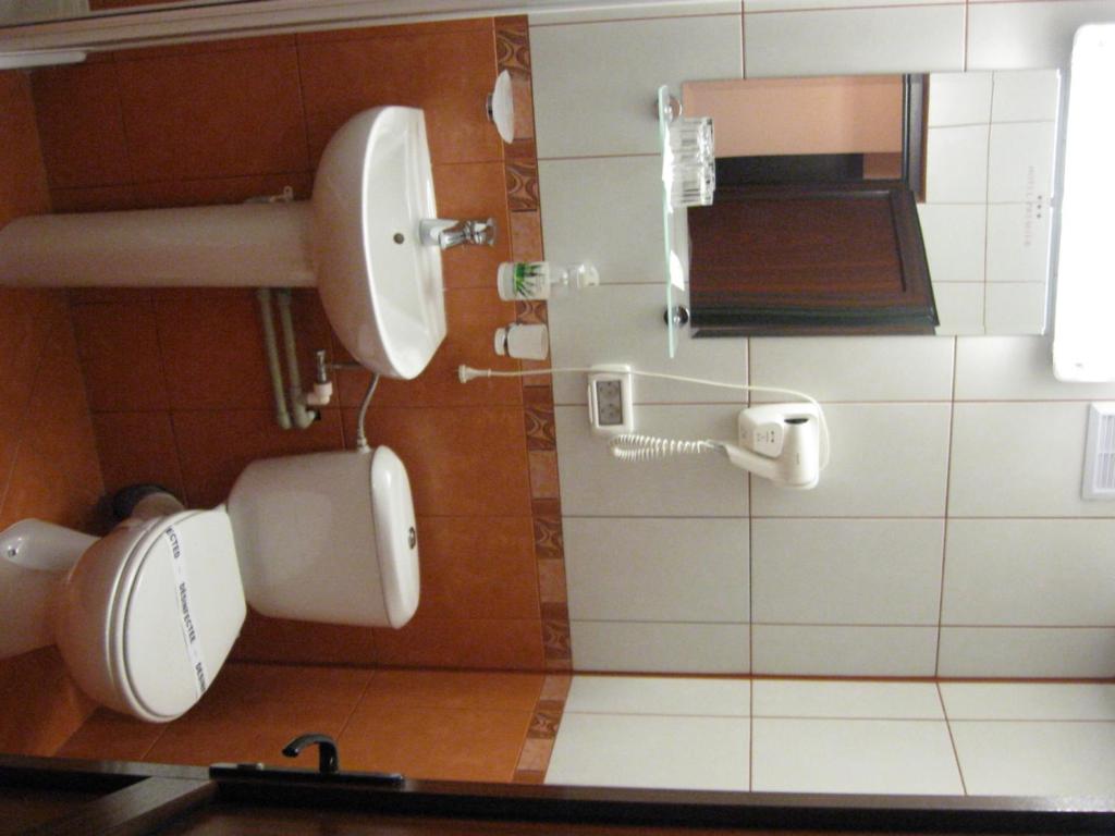 Koupelna v ubytování Hotel Premiere