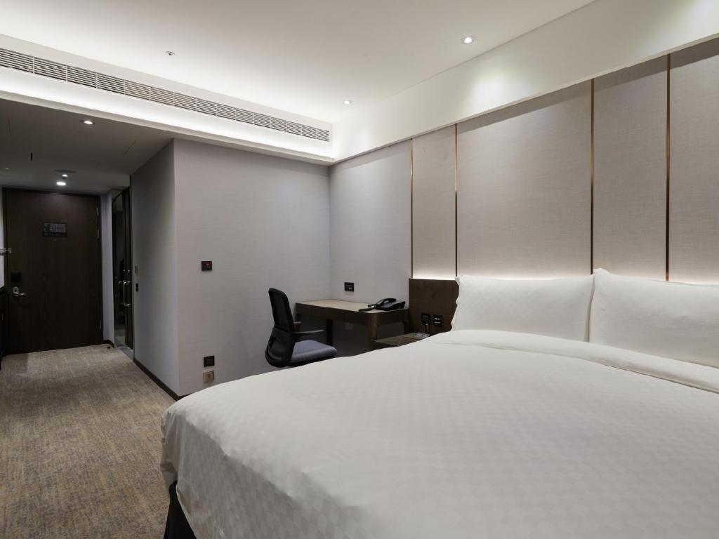 Postel nebo postele na pokoji v ubytování The Tango Hotel Taipei Linsen