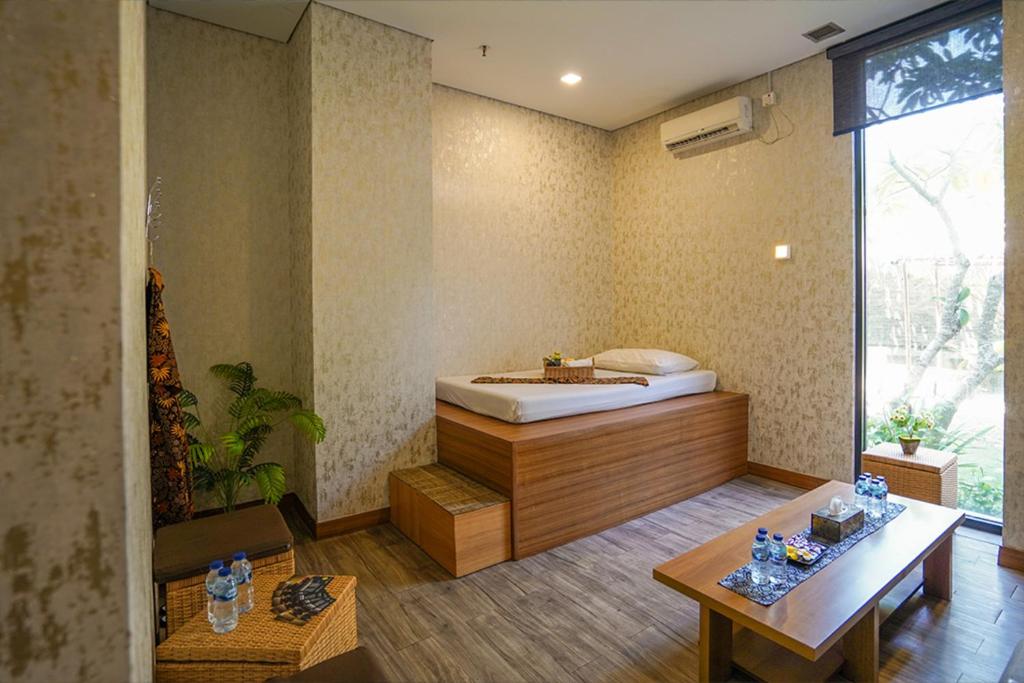 Postel nebo postele na pokoji v ubytování BATIQA Hotel Palembang