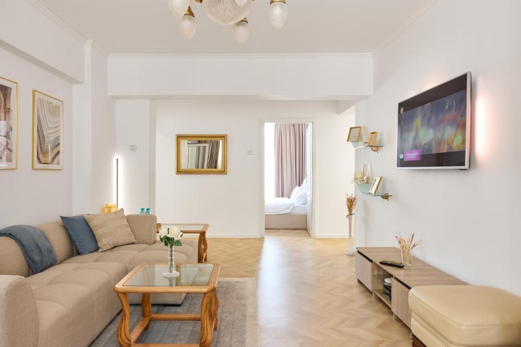 a living room with a couch and a table at 20 Apartment Centre in Bucharest