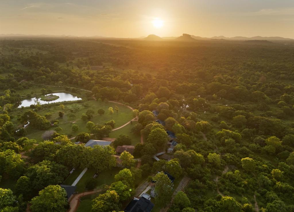 an aerial view of a park at sunset at Ayugiri Ayurveda Wellness Resort Sigiriya in Sigiriya
