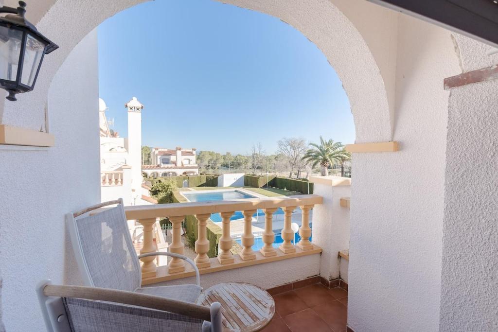a balcony with a view of a pool at Casa Azahara by MarCalma in El Casalot