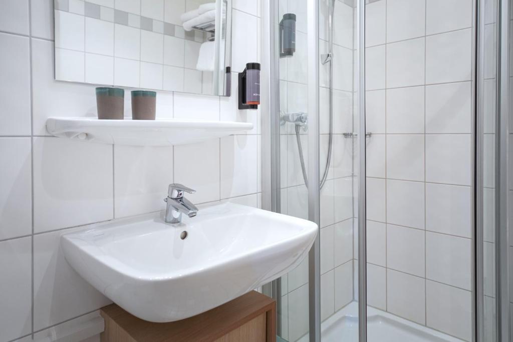Koupelna v ubytování Roomingtons Hotel Franziskushöhe Lohr