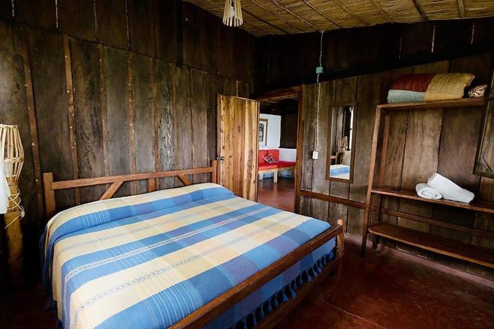 Postel nebo postele na pokoji v ubytování Los Amigos Ecoturismo y Reserva Natural