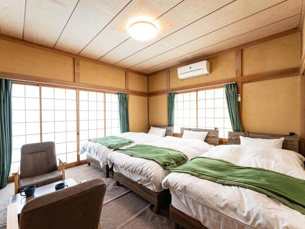 Postel nebo postele na pokoji v ubytování Ocean villa 大洗