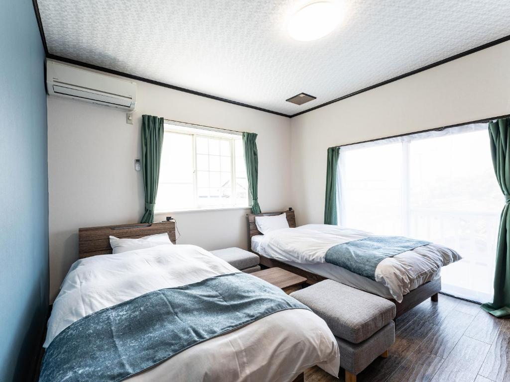 Postel nebo postele na pokoji v ubytování Ocean villa 大洗