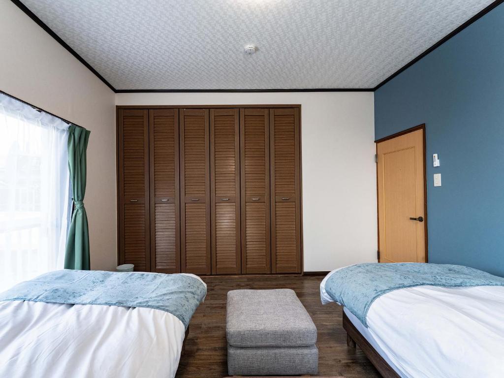 Postel nebo postele na pokoji v ubytování Ocean villa 大洗