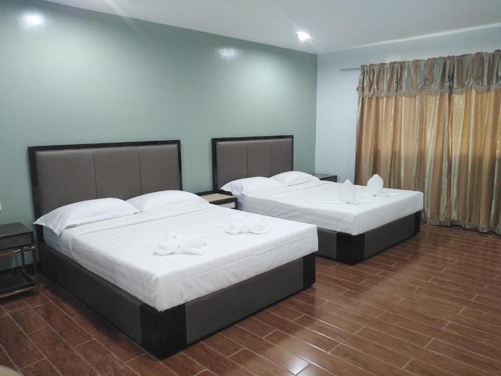 Postel nebo postele na pokoji v ubytování Asia Jem Hotel - BAYAWAN