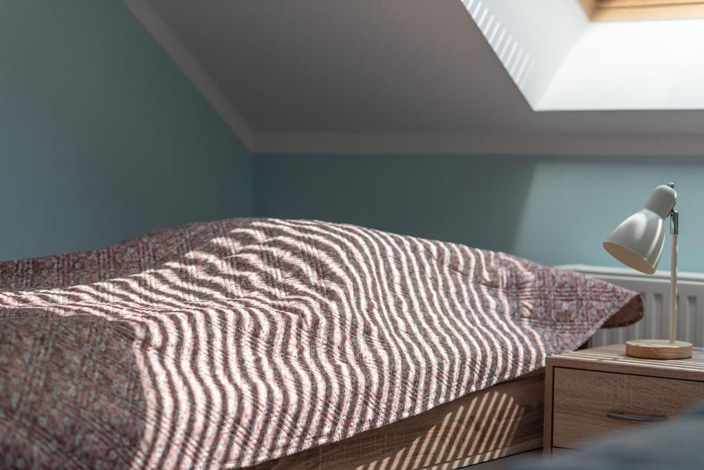 Una cama o camas en una habitación de Villa Tuchoměřice