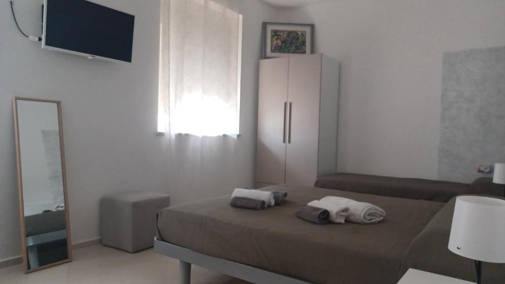 TV a/nebo společenská místnost v ubytování B&B Le perle fg