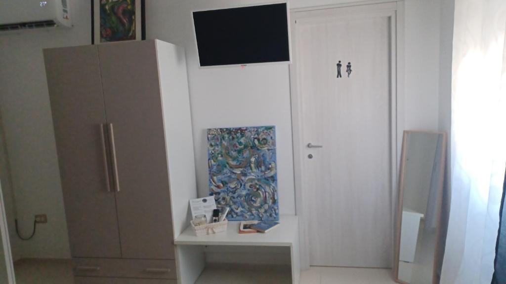 TV a/nebo společenská místnost v ubytování B&B Le perle fg