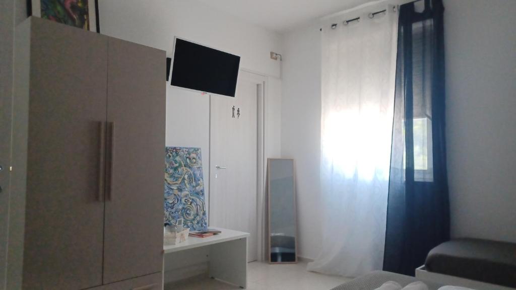 TV a/nebo společenská místnost v ubytování B&B Le perle fg