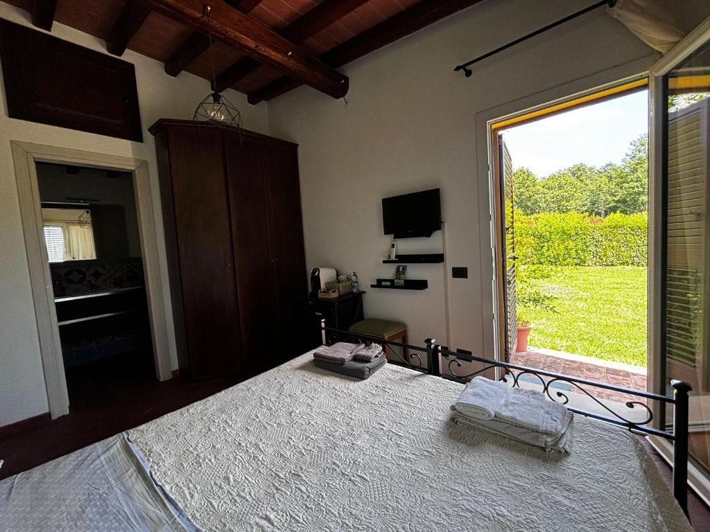 Postel nebo postele na pokoji v ubytování IL Poggio