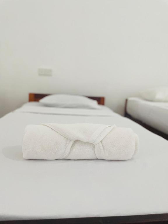 Postel nebo postele na pokoji v ubytování ZIMBAY Guest House
